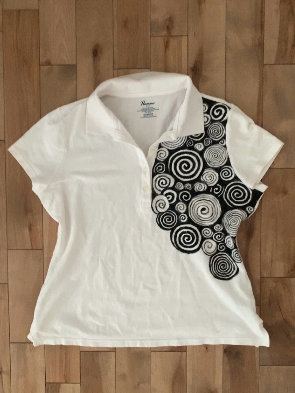 White polo shirt with spiral design